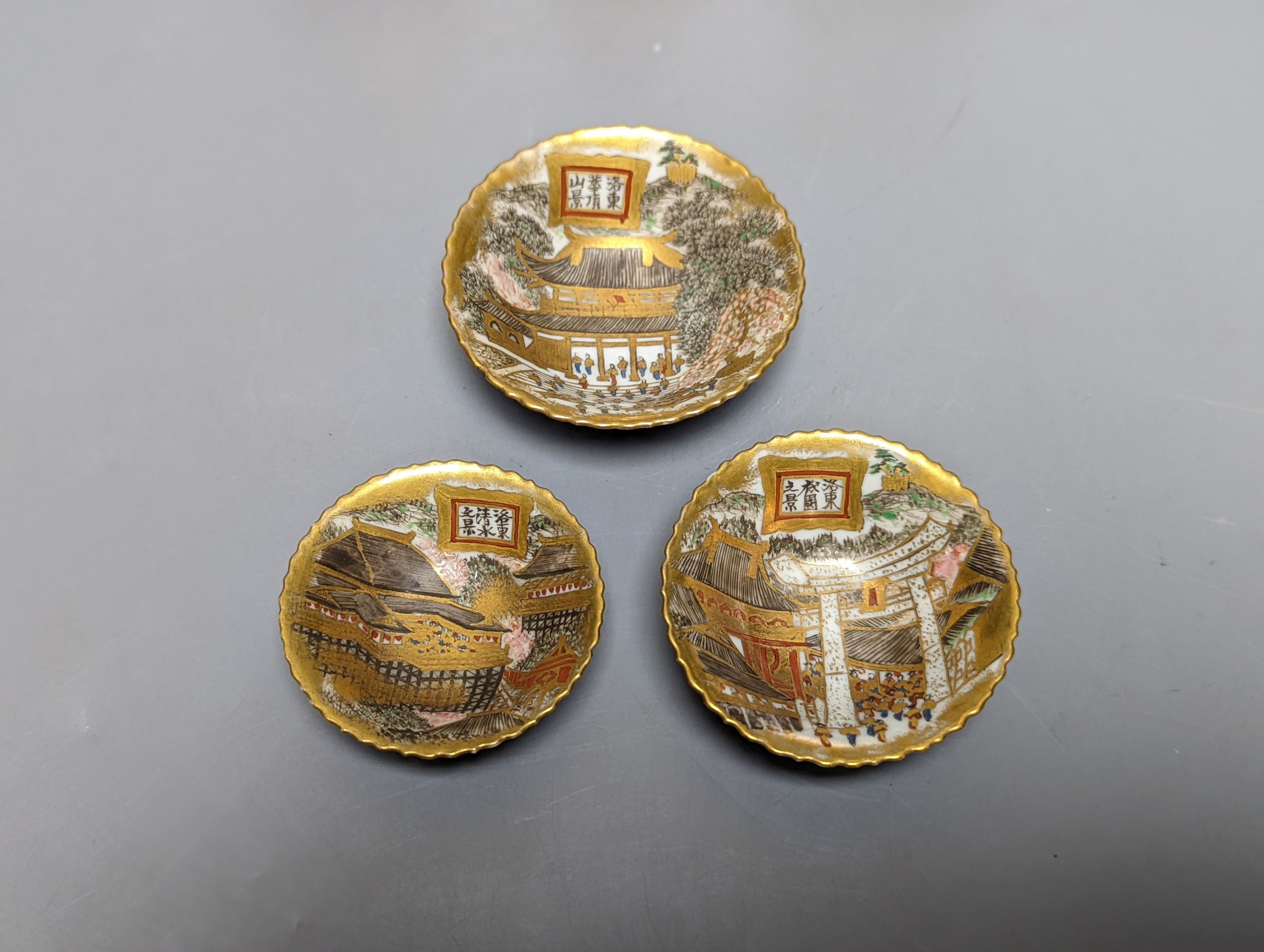 Three Japanese graduated porcelain miniature bowls, a pair of small Satsuma vases and another, pair of vases 12 cms high (6)